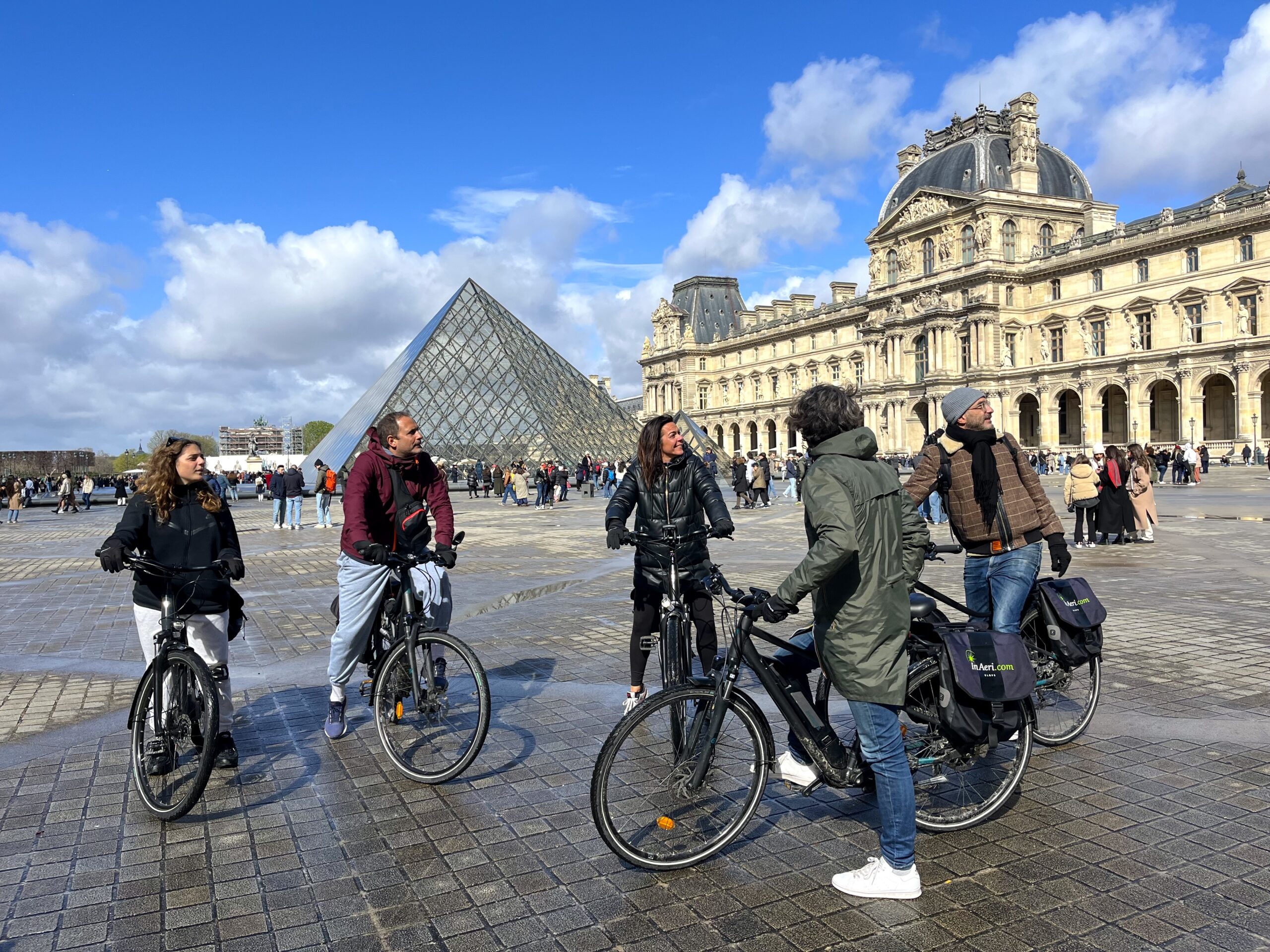 paris electric bike tour in front of the Louvre